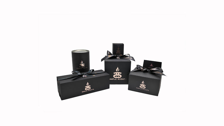 Simple Scents products in black and rose gold packaging