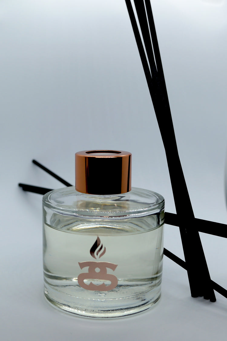 Simple Scents Excellence Reed Diffuser with black reeds placed at angles