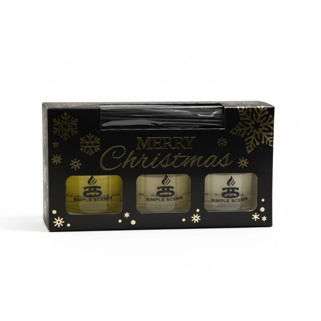 Simple Scents Festive Indulgence reed diffuser trio in a black and gold Christmas gift box with three bottles and black reeds.