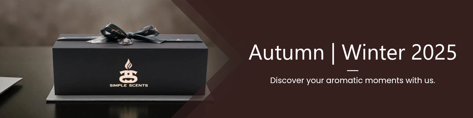 Black box with ribbon tie detailing Autumn/Winter offerings