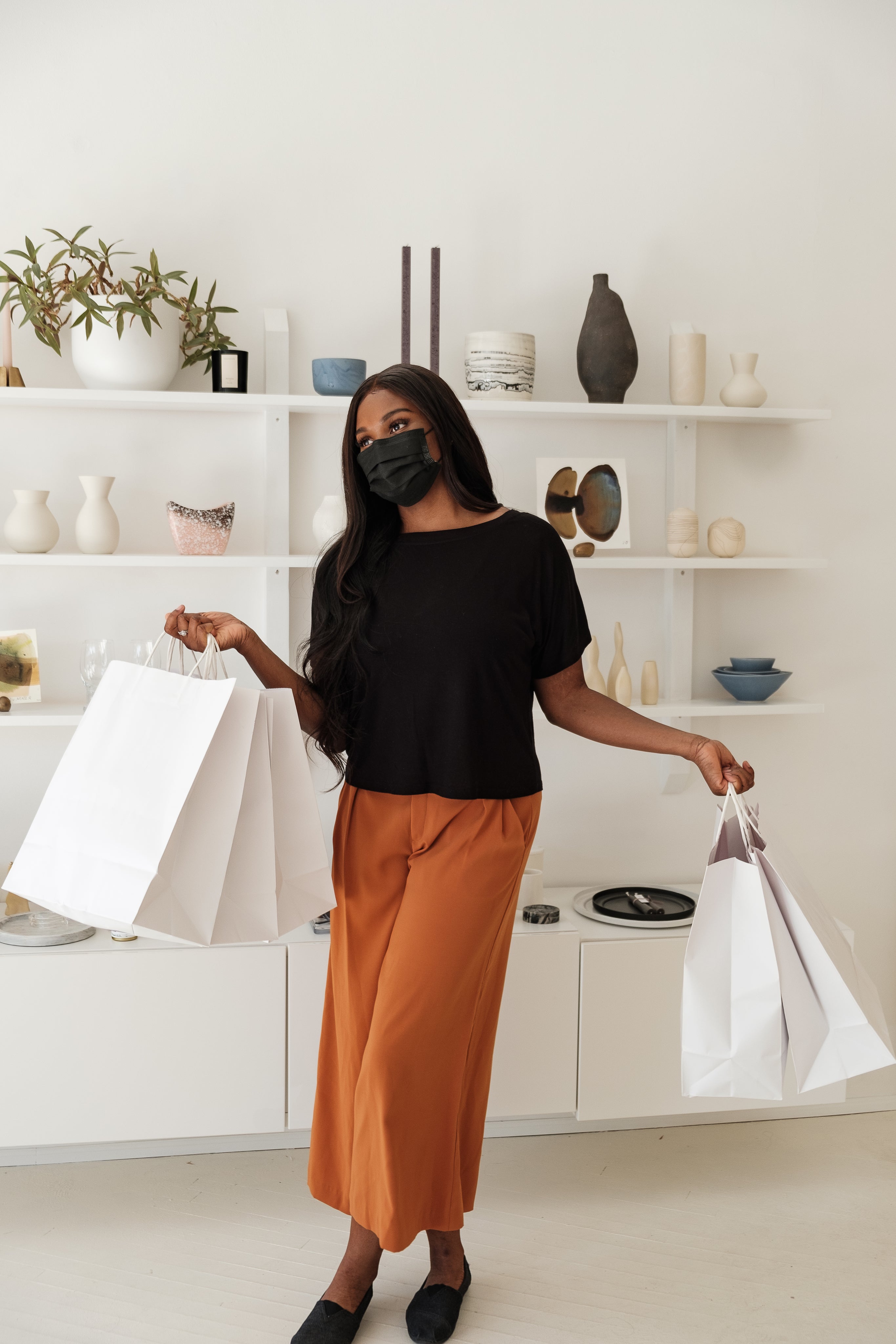 Woman with shopping bags in both hands