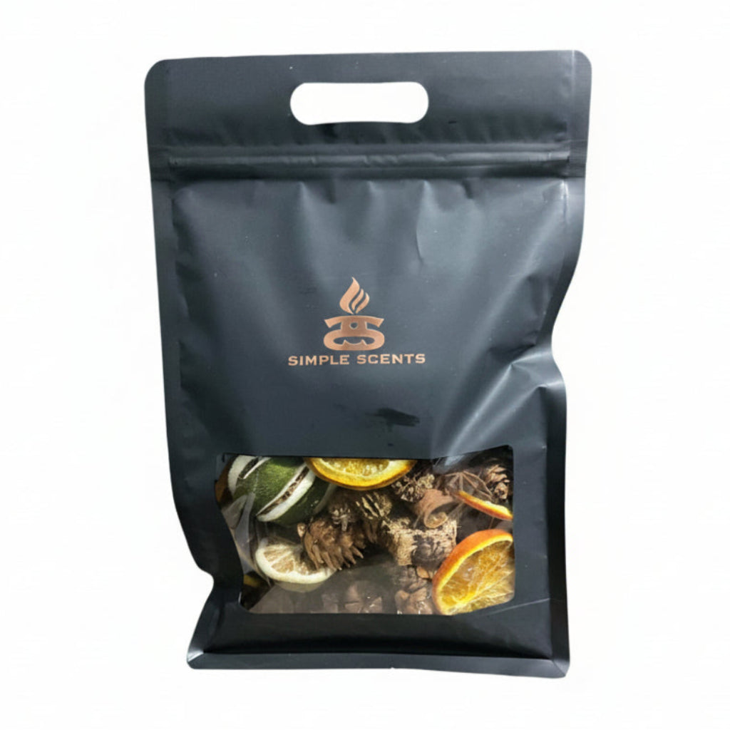 Natural Spice & Citrus Boujee Potpourri in Simple Scents premium matte black branded packaging with clear window displaying whole citrus fruits, dried orange slices and natural botanical blend