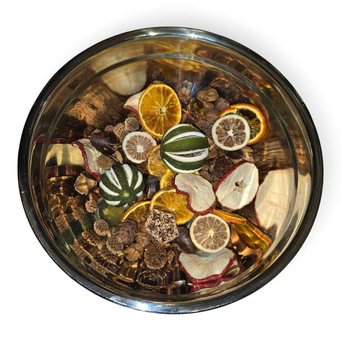 Natural Spice & Citrus Boujee Potpourri overhead view in a silver bowl showcasing whole dried green oranges, orange and citrus slices, red apple slices, casurina cones, mini pine cones and mixed natural botanics