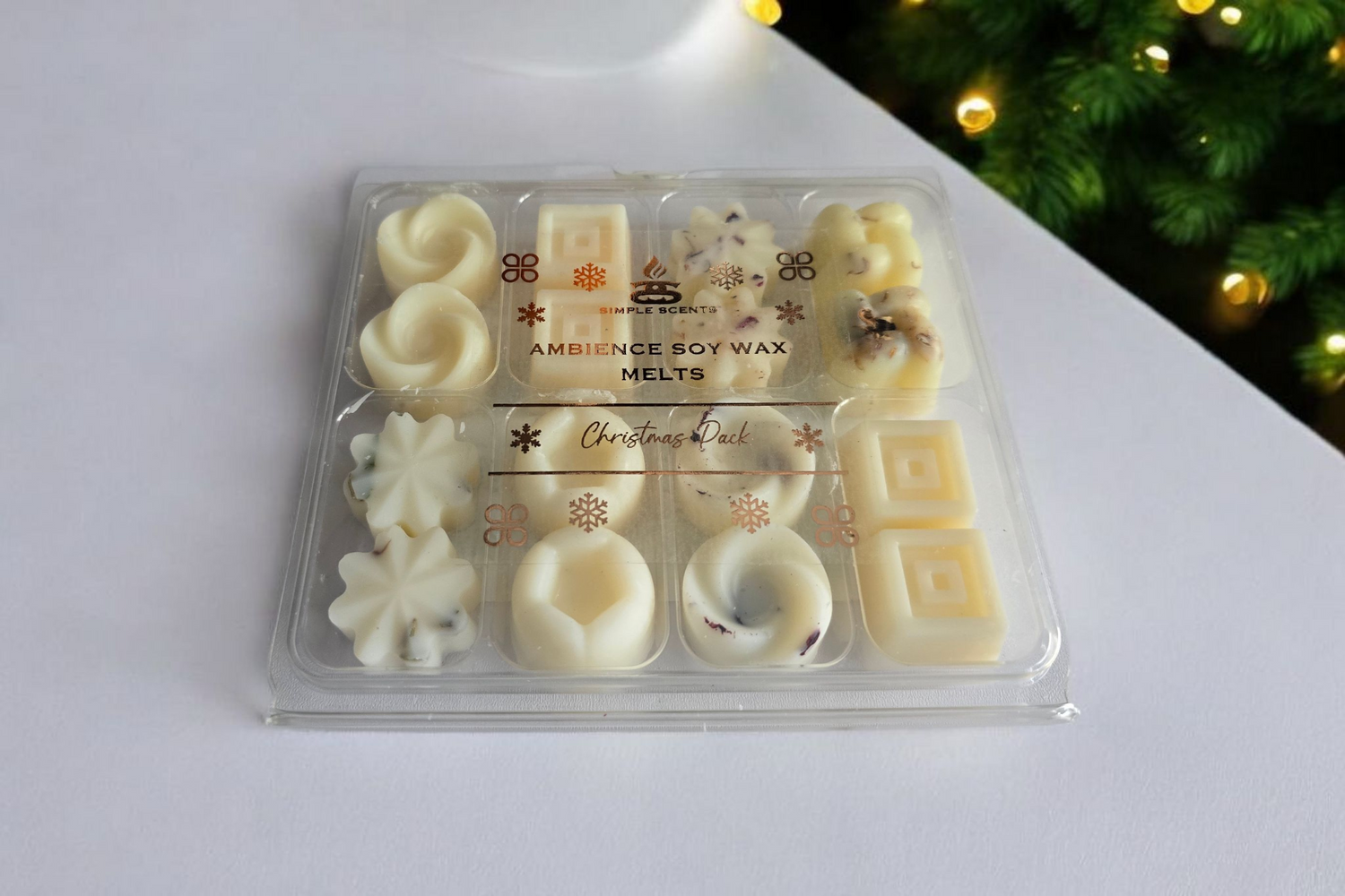 Pack of ambiance soy wax melts with Christmas design on a white surface.