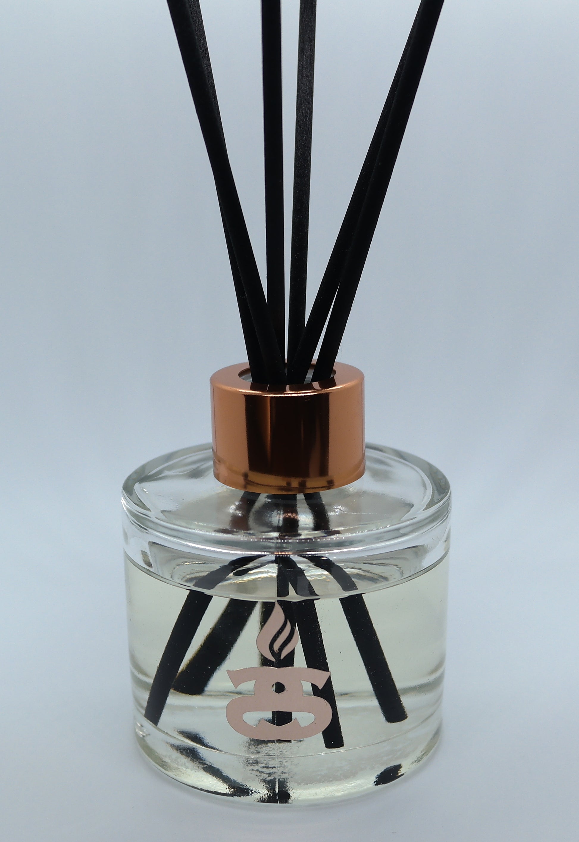 Simple Scents Excellence Reed Diffuser in 100ml glass squat bottle with rose gold cap lid and black fibre reeds inside bottle neck