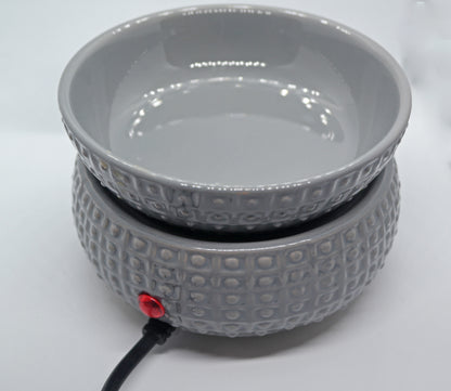 Grey dimpled ceramic electric wax and candle warmer empty