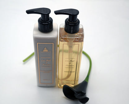 Lime Basil & Mandarin Hand Wash & Lotion set in bottles with black lily